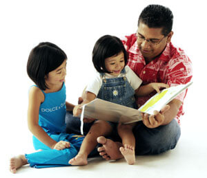 father-reading-to-children